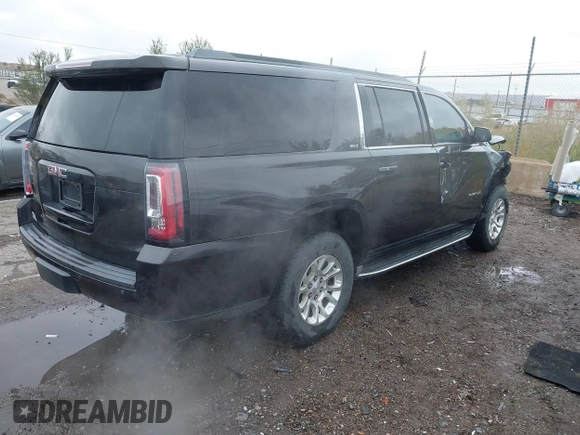 2015 GMC Yukon XL SLT with VIN 1GKS1HKC8FR219289, listed as a IAAI auction lot 40772496 with 163,477 mi miles. Bid and sale history available at carsss.com. Image 4.