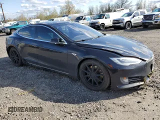 2016 Tesla Model S 90D with VIN 5YJSA1E2XGF150490, listed as a Copart auction lot 51070365 with 144,457 mi miles and Salvage Title. Bid and sale history available at DreamBid. Image 4.