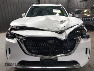 2024 Mazda CX-90 S Premium z VIN JM3KKDHCXR1103272, wystawiony jako IAAI lot #40301969 z przebiegiem 5 235 mil mil oraz . Historia ofert i sprzedaży dostępna na DreamBid. Obrazek 6.