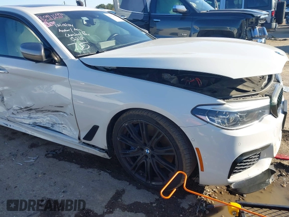 2018 BMW 5 Series M550i xDrive with VIN WBAJB9C54JB050218, listed as a IAAI auction lot 41132695 with 69,659 mi miles. Bid and sale history available at carsss.com. Image 1.