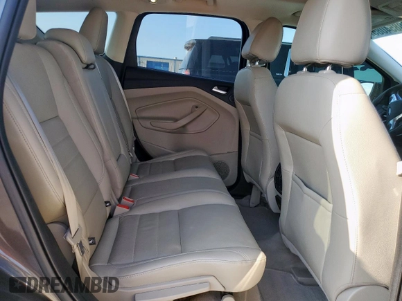 2015 Ford Escape Titanium with VIN 1FMCU0J97FUC88093, listed as a Copart auction lot 60854085 with 64,029 mi miles and Salvage title. Bid and sale history available at DreamBid. Image 11.