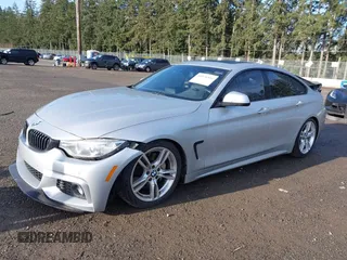 2016 BMW 4 Series 428i xDrive with VIN WBA4C9C5XGG135893, listed as a IAAI auction lot 41976541 with 86,987 mi miles and . Bid and sale history available at carsss.com. Image 2.