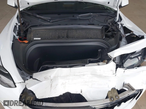 2023 Tesla Model Y Long Range z VIN 7SAYGDEE2PF834036, wystawiony jako IAAI lot #41933120 z przebiegiem 27 872 mil mil oraz . Historia ofert i sprzedaży dostępna na DreamBid. Obrazek 10.