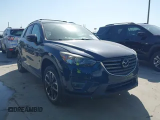 2016 Mazda CX-5 Grand Touring z VIN JM3KE2DY3G0797321, wystawiony jako IAAI lot #42017174 z przebiegiem 65 505 mil mil oraz . Historia ofert i sprzedaży dostępna na DreamBid. Obrazek 1.