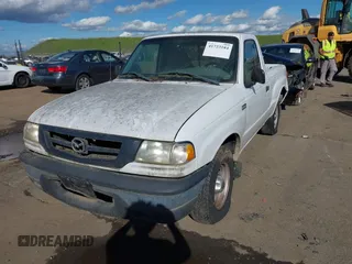 2002 Mazda B-Series 2WD Truck SX with VIN 4F4YR12D42TM18276, listed as a IAAI auction lot 41723184 with 142,623 mi miles. Bid and sale history available at carsss.com. Image 2.