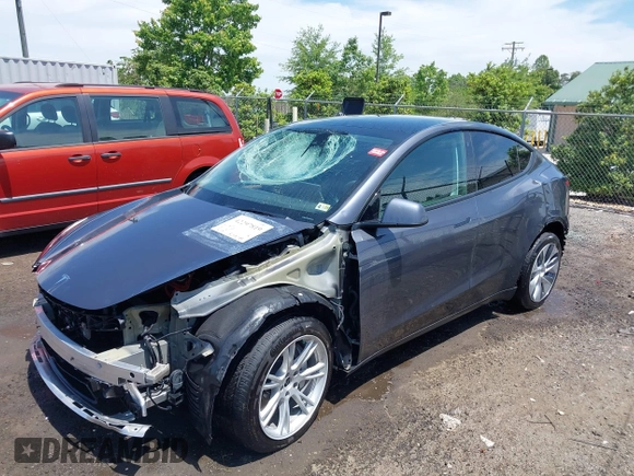 2023 Tesla Model Y Long Range with VIN 7SAYGAEE7PF615751, listed as a IAAI auction lot 42297819 with 31,201 mi miles and . Bid and sale history available at DreamBid. Image 2.