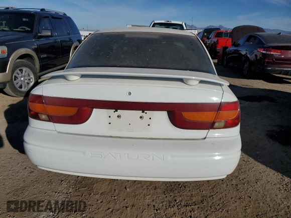 2001 Saturn SL z VIN 1G8ZK54771Z331414, wystawiony jako Copart lot #83895804 z przebiegiem 129 790 mil mil oraz Szkody całkowita. Historia ofert i sprzedaży dostępna na DreamBid. Obrazek 6.