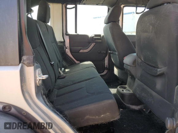 2016 Jeep Wrangler Unlimited Freedom with VIN 1C4BJWDG7GL117972, listed as a Copart auction lot 57996765 with 56,713 mi miles and Salvage title. Bid and sale history available at DreamBid. Image 11.