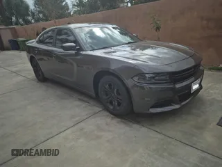 2020 Dodge Charger SXT with VIN 2C3CDXBG7LH232748, listed as a IAAI auction lot 42168856 with 26,527 mi miles. Bid and sale history available at carsss.com. Image 1.