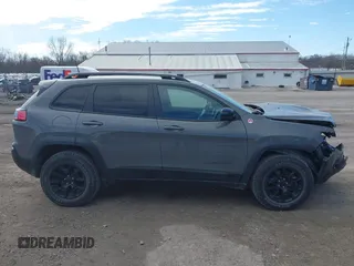 2022 Jeep Cherokee Trailhawk with VIN 1C4PJMBX5ND541929, listed as a IAAI auction lot 41815823 with 68,112 mi miles and . Bid and sale history available at DreamBid. Image 14.