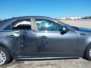 2013 Cadillac CTS Luxury with VIN 1G6DE5E5XD0146158, listed as a IAAI auction lot 42531205 with 130,669 mi miles and . Bid and sale history available at DreamBid. Image 14.