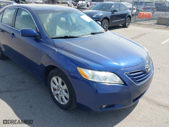 2007 Toyota Camry CE with VIN JTNBE46K373056707, listed as a IAAI auction lot 42128026 with 242,887 mi miles. Bid and sale history available at carsss.com. Image 6.