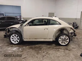 2019 Volkswagen Beetle S with VIN 3VWFD7ATXKM705322, listed as a IAAI auction lot 41409600 with 97,479 mi miles. Bid and sale history available at carsss.com. Image 15.