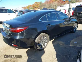 2018 Mazda 6 Grand Touring with VIN JM1GL1TY0J1319083, listed as a IAAI auction lot 40852818 with 57,408 mi miles and . Bid and sale history available at DreamBid. Image 4.