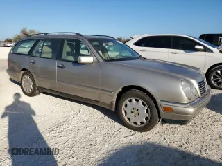 1998 Mercedes-Benz E-Class with VIN WDBJH65F9WA597132, listed as a Copart auction lot 77780094 with 0 mi miles and Salvage Title. Bid and sale history available at carsss.com. Image 4.