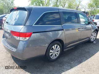 2014 Honda Odyssey EX-L with VIN 5FNRL5H60EB117218, listed as a IAAI auction lot 42201739 with 184,586 mi miles and . Bid and sale history available at DreamBid. Image 4.