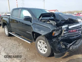 2019 GMC Canyon 4WD SLE z VIN 1GTG6CEN2K1354585, wystawiony jako IAAI lot #42014158 z przebiegiem 34 269 mil mil oraz . Historia ofert i sprzedaży dostępna na DreamBid. Obrazek 1.