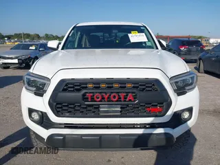 2018 Toyota Tacoma SR with VIN 5TFAX5GN2JX128621, listed as a IAAI auction lot 41797514 with 216,251 mi miles and . Bid and sale history available at DreamBid. Image 12.