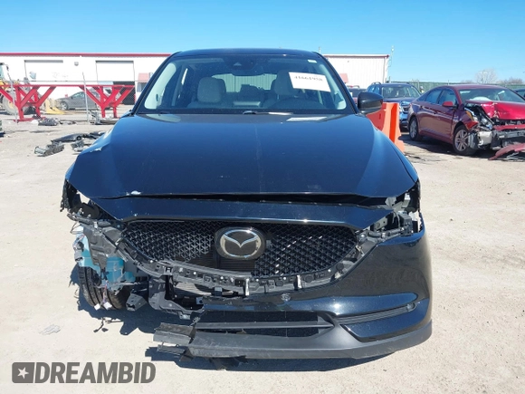 2020 Mazda CX-5 Grand Touring with VIN JM3KFBDMXL0763316, listed as a IAAI auction lot 41661958 with 64,881 mi miles and . Bid and sale history available at carsss.com. Image 13.