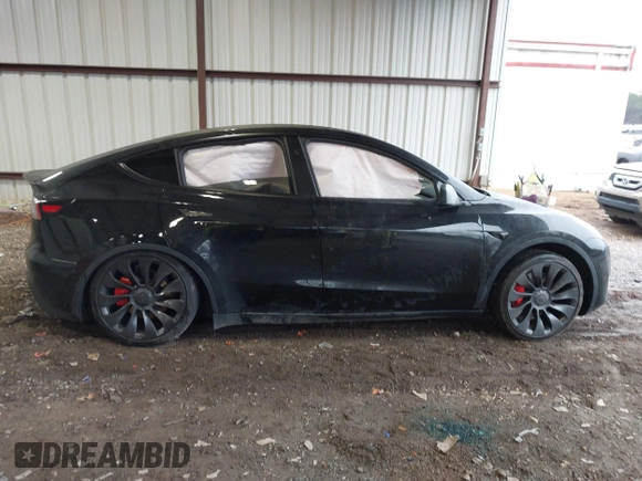 2023 Tesla Model Y Performance with VIN 7SAYGDEF2PF800641, listed as a IAAI auction lot 41612596 with 60,984 mi miles and . Bid and sale history available at DreamBid. Image 13.