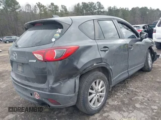 2015 Mazda CX-5 Touring with VIN JM3KE2CY2F0461935, listed as a IAAI auction lot 41430070 with 220,857 mi miles and . Bid and sale history available at carsss.com. Image 4.