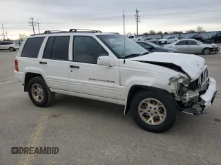 1998 Jeep Grand Cherokee Limited with VIN 1J4GZ78Y5WC259043, listed as a Copart auction lot 43976955 with 212,910 mi miles and Salvage Title. Bid and sale history available at carsss.com. Image 4.