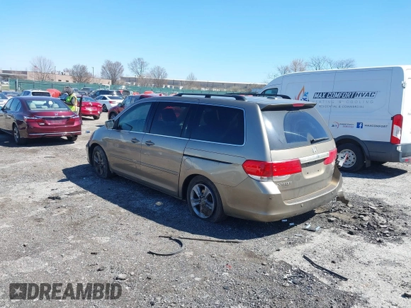 2010 Honda Odyssey Touring with VIN 5FNRL3H9XAB094765, listed as a IAAI auction lot 41892743 with 127,143 mi miles. Bid and sale history available at carsss.com. Image 3.