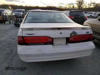 1995 Ford Thunderbird LX with VIN 1FALP62W3SH119037, listed as a Copart auction lot 41517485 with 164,133 mi miles and Salvage Title. Bid and sale history available at carsss.com. Image 6.