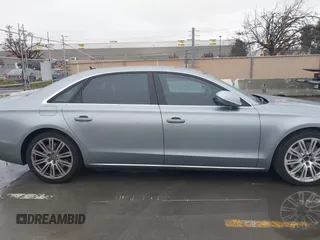 2012 Audi A8 z VIN WAURVAFD5CN008320, wystawiony jako IAAI lot #41508237 z przebiegiem 183 398 mil mil oraz . Historia ofert i sprzedaży dostępna na DreamBid. Obrazek 13.