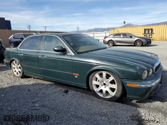 2004 Jaguar XJ with VIN SAJWA71C34SG29498, listed as a Copart auction lot 42653715 with 116,956 mi miles and Salvage Title. Bid and sale history available at carsss.com. Image 4.