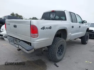 2004 Dodge Dakota Sport with VIN 1D7HG38NX4S608298, listed as a IAAI auction lot 41621473 with 192,876 mi miles. Bid and sale history available at carsss.com. Image 4.