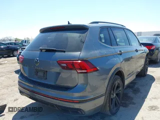 2023 Volkswagen Tiguan SE R-Line Black z VIN 3VVCB7AX1PM057201, wystawiony jako IAAI lot #41977239 z przebiegiem 84 840 mil mil oraz . Historia ofert i sprzedaży dostępna na DreamBid. Obrazek 4.