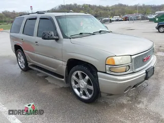 2002 GMC Yukon Denali z VIN 1GKEK63U52J314990, wystawiony jako IAAI lot #41897020 z przebiegiem 232 088 mil mil oraz . Historia ofert i sprzedaży dostępna na DreamBid. Obrazek 1.