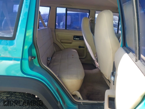 1996 Jeep Cherokee Sport z VIN 1J4FJ68S2TL103997, wystawiony jako IAAI lot #41517835 z przebiegiem 175 560 mil mil oraz . Historia ofert i sprzedaży dostępna na DreamBid. Obrazek 8.