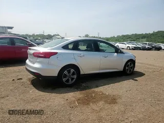 2017 Ford Focus SE with VIN 1FADP3FE7HL290271, listed as a Copart auction lot 60665615 with 130,409 mi miles and Salvage title. Bid and sale history available at DreamBid. Image 14.