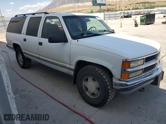 1999 Chevrolet Suburban with VIN 3GNFK16R4XG190883, listed as a Copart auction lot 58324415 with 228,782 mi miles and Salvage title. Bid and sale history available at DreamBid. Image 4.