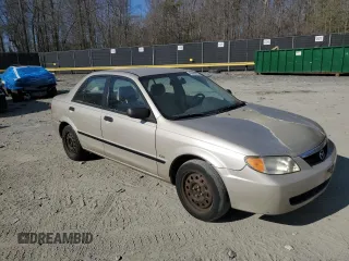 2002 Mazda Protege DX with VIN JM1BJ225520525472, listed as a Copart auction lot 45699915 with 183,457 mi miles and Salvage Title. Bid and sale history available at DreamBid. Image 4.