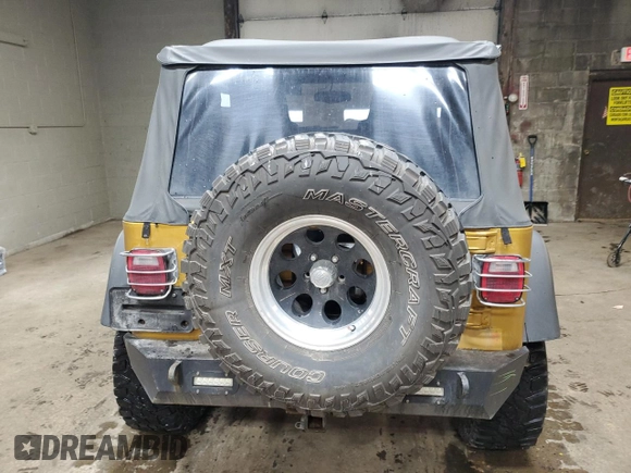 2003 Jeep Wrangler Rubicon with VIN 1J4FA69S23P322353, listed as a Copart auction lot 43915745 with 117,769 mi miles and Salvage title. Bid and sale history available at DreamBid. Image 6.