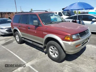 1999 Mitsubishi Montero LS z VIN JA4LS31H1XP034327, wystawiony jako Copart lot #52573485 z przebiegiem 286 753 mil mil oraz Szkoda całkowita • Salvage title. Historia ofert i sprzedaży dostępna na DreamBid. Obrazek 4.