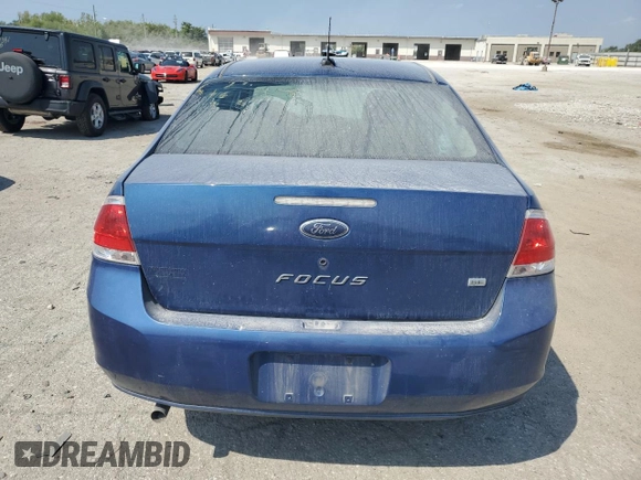2009 Ford Focus SE with VIN 1FAHP35N69W173977, listed as a Copart auction lot 69018554 with 138,496 mi miles and Salvage Title. Bid and sale history available at DreamBid. Image 6.