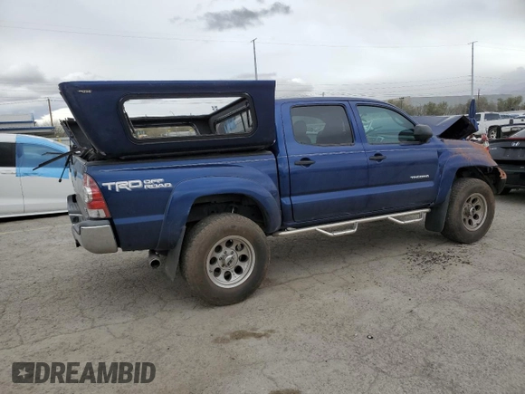 2014 Toyota Tacoma with VIN 5TFLU4EN7EX106909, listed as a Copart auction lot 46906235 with 102,681 mi miles and Salvage Title. Bid and sale history available at DreamBid. Image 3.