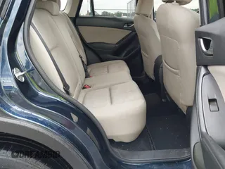 2016 Mazda CX-5 Sport with VIN JM3KE2BY0G0850298, listed as a IAAI auction lot 42107007 with 97,478 mi miles. Bid and sale history available at carsss.com. Image 8.