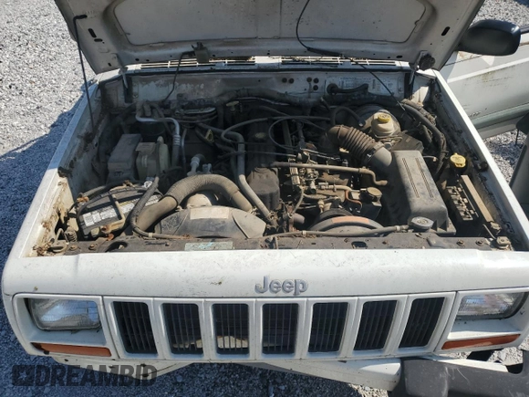 1999 Jeep Cherokee Sport z VIN 1J4FF68S3XL597049, wystawiony jako Copart lot #58736325 z przebiegiem 134 684 mil mil oraz Nie do naprawy • Non repairable. Historia ofert i sprzedaży dostępna na DreamBid. Obrazek 11.