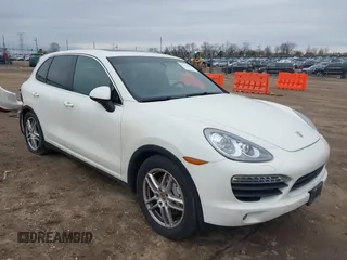 2012 Porsche Cayenne S Hybrid z VIN WP1AE2A2XCLA90180, wystawiony jako IAAI lot #41464131 z przebiegiem 127 127 mil mil oraz . Historia ofert i sprzedaży dostępna na DreamBid. Obrazek 1.