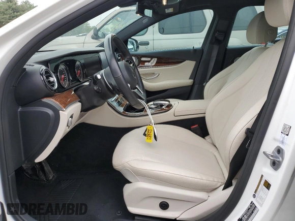 2019 Mercedes-Benz E 300 with VIN WDDZF4KB9KA520910, listed as a Copart auction lot 54697765 with 69,324 mi miles and Salvage title. Bid and sale history available at DreamBid. Image 7.