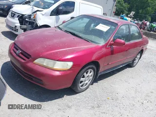 2002 Honda Accord SE z VIN 1HGCG56712A020105, wystawiony jako IAAI lot #42504254 z przebiegiem 317 533 mil mil oraz . Historia ofert i sprzedaży dostępna na DreamBid. Obrazek 2.
