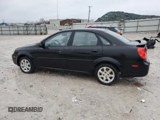 2005 Suzuki Forenza S z VIN KL5JD56Z65K100830, wystawiony jako Copart lot #85256494 z przebiegiem 74 543 mil mil oraz Tytuł czysty. Historia ofert i sprzedaży dostępna na DreamBid. Obrazek 2.
