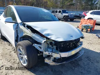 2023 Tesla Model Y Long Range with VIN 7SAYGAEE1PF828338, listed as a IAAI auction lot 40978725 with Not Provided miles and . Bid and sale history available at DreamBid. Image 6.
