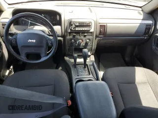 2004 Jeep Grand Cherokee Laredo with VIN 1J4GW48S54C430857, listed as a Copart auction lot 62744305 with 122,099 mi miles and Salvage title. Bid and sale history available at DreamBid. Image 8.