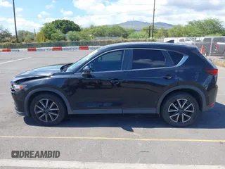 2018 Mazda CX-5 Touring z VIN JM3KFACM5J0309533, wystawiony jako IAAI lot #42195429 z przebiegiem 91 928 mil mil oraz . Historia ofert i sprzedaży dostępna na DreamBid. Obrazek 14.